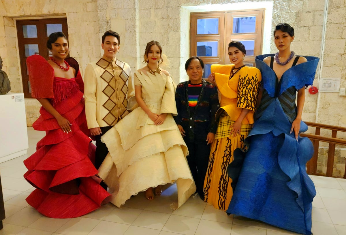 Shanon Pamaong, one of the most prominent Boholano designers, with their Maria Clara-inspired collection in the colors of the Philippine flag.
